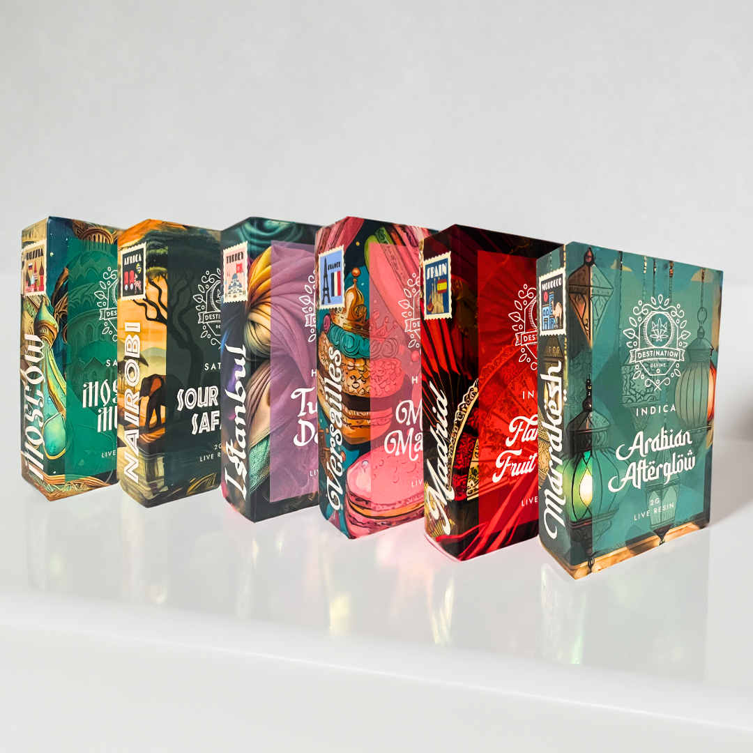 Five vibrant deVINE Destinations Live Resin THC Cartridge boxes from DeVINE Wellness, each with artistic designs and strain names, are arranged diagonally on a white surface—ideal for cannabis connoisseurs and travel-inspired vaping fans.