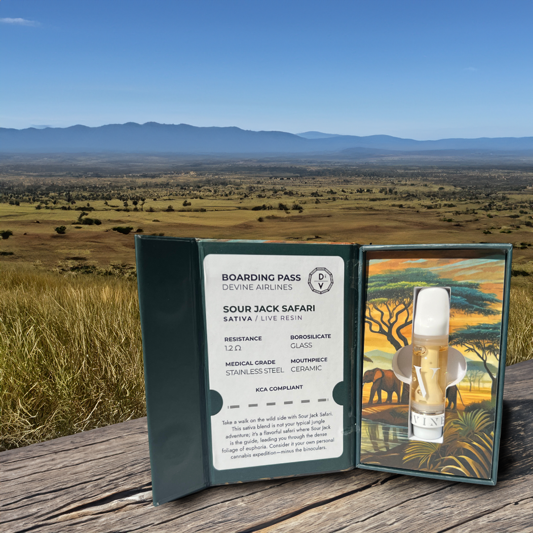 A deVINE Destinations Live Resin THC Cartridge by DeVINE Wellness rests in an open safari-themed box on wood, overlooking a savannah and distant mountains—ideal for cannabis connoisseurs seeking travel-inspired vaping experiences.